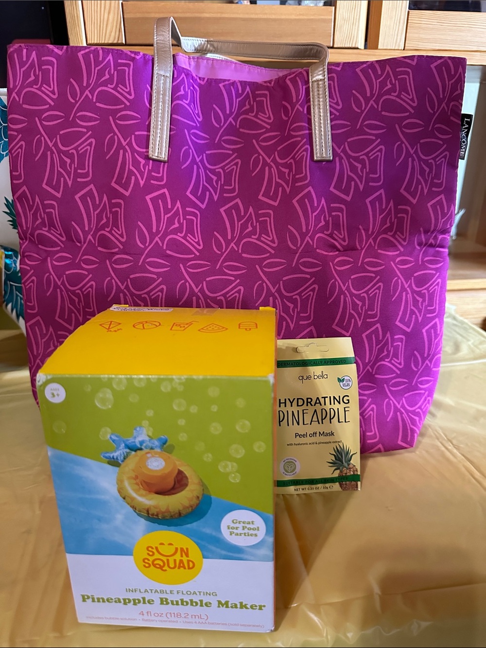 Pineapple Bubble Maker, Pink Lancôme tote and Que Bella Vegan Pineapple Mask